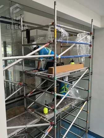 tinted-installation-corporate-building-window-glass-scaffolding